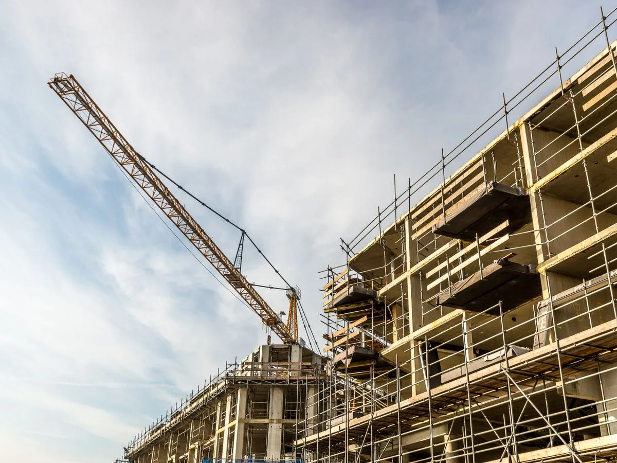 Construction cranes over Al Jubail representing Saudi Vision 2030 growth